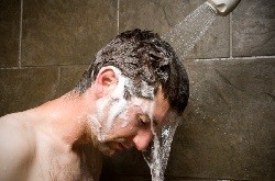 Man-Showering-Water-Washing-Over-Him